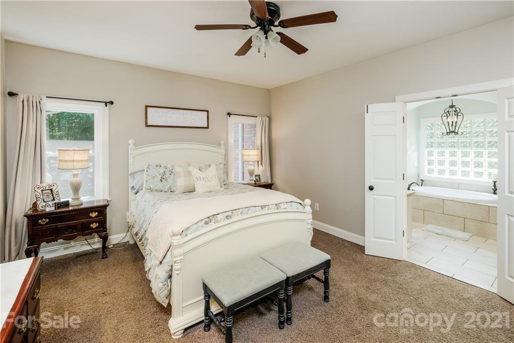 1172 Ben Black Road Midland, NC 28107 - Photo 18 of 48 a bedroom with a bed and wooden floor