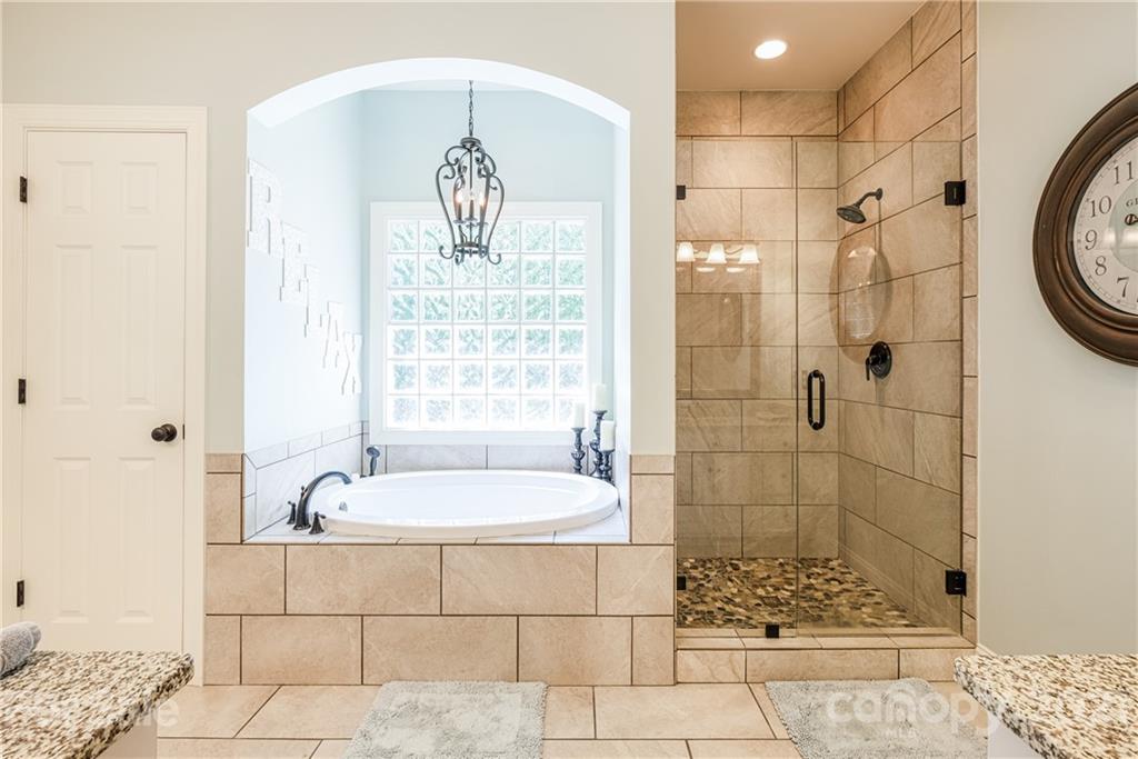 1172 Ben Black Road Midland, NC 28107 - Photo 19 of 48 a bathroom with a bathtub and shower