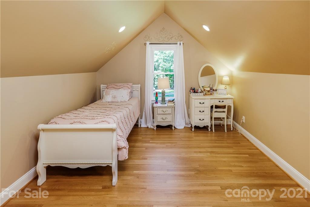1172 Ben Black Road Midland, NC 28107 - Photo 32 of 48 a bedroom with a bed and a table in it