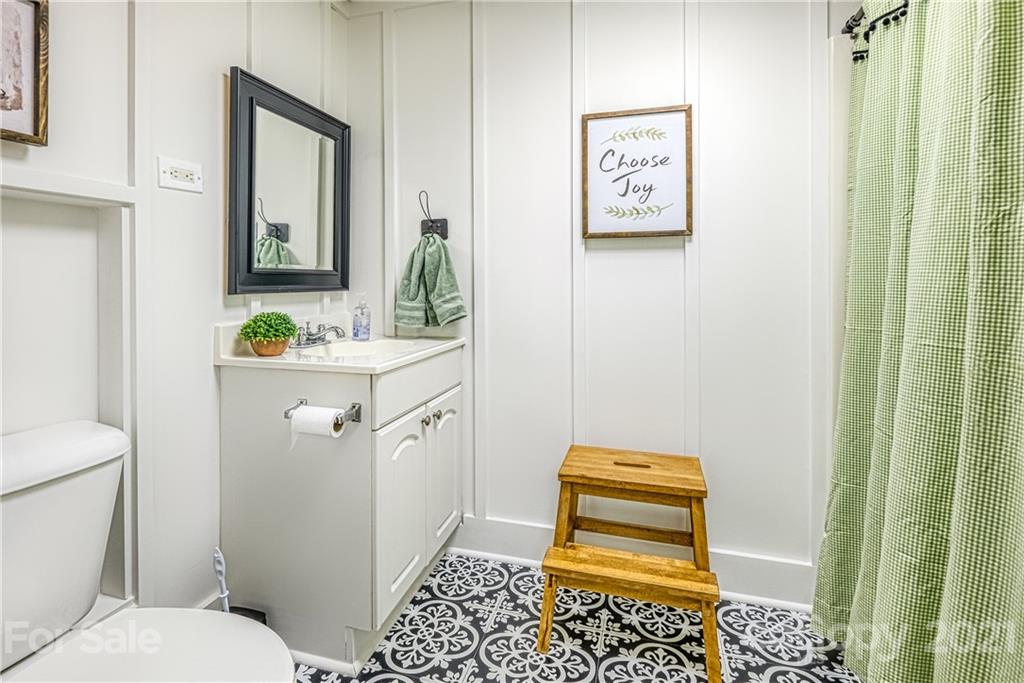1172 Ben Black Road Midland, NC 28107 - Photo 36 of 48 a bathroom with a sink toilet and shower