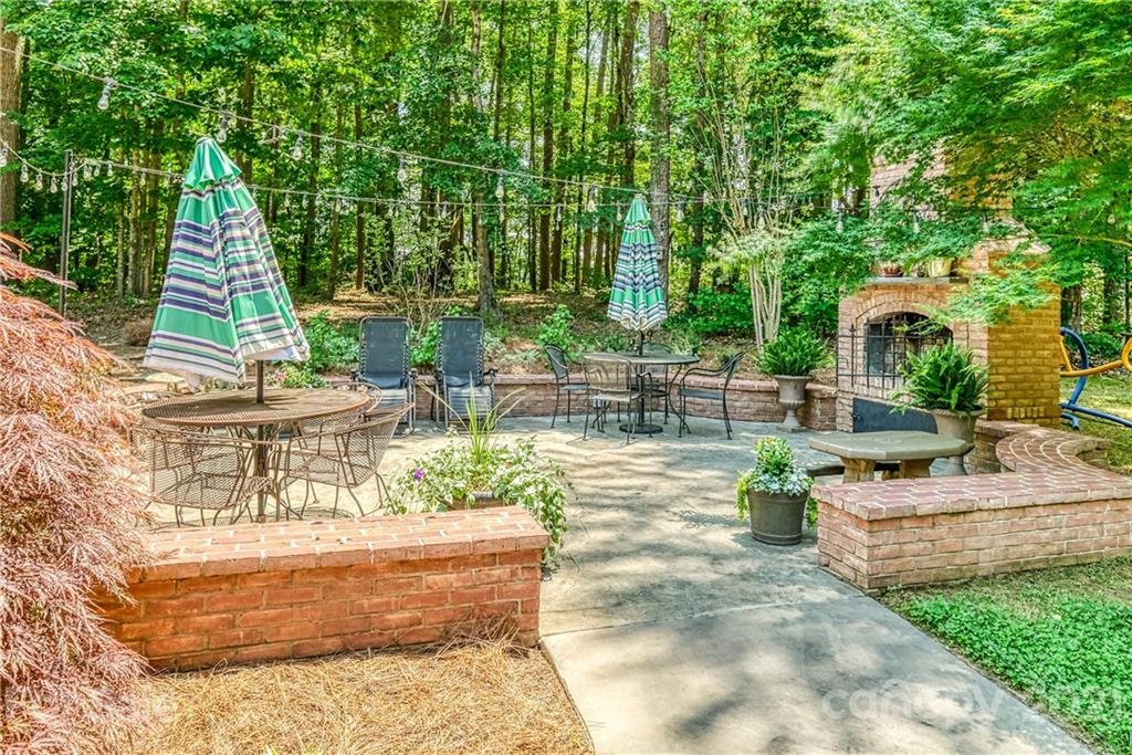 1172 Ben Black Road Midland, NC 28107 - Photo 39 of 48 a view of backyard with plants and outdoor seating