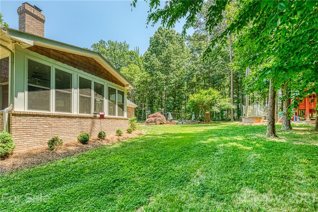 1172 Ben Black Road Midland, NC 28107 - Photo 41 of 48 a front view of a house with garden