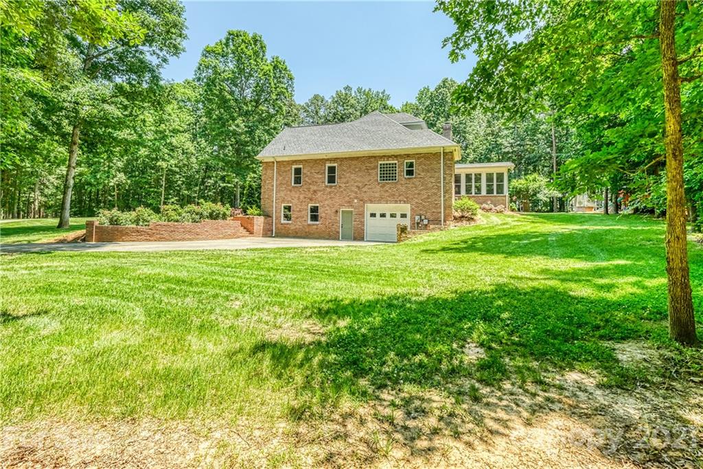 1172 Ben Black Road Midland, NC 28107 - Photo 42 of 48 a front view of a house with garden