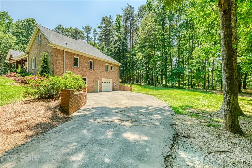 1172 Ben Black Road Midland, NC 28107 - Photo 43 of 48 a front view of a house with garden