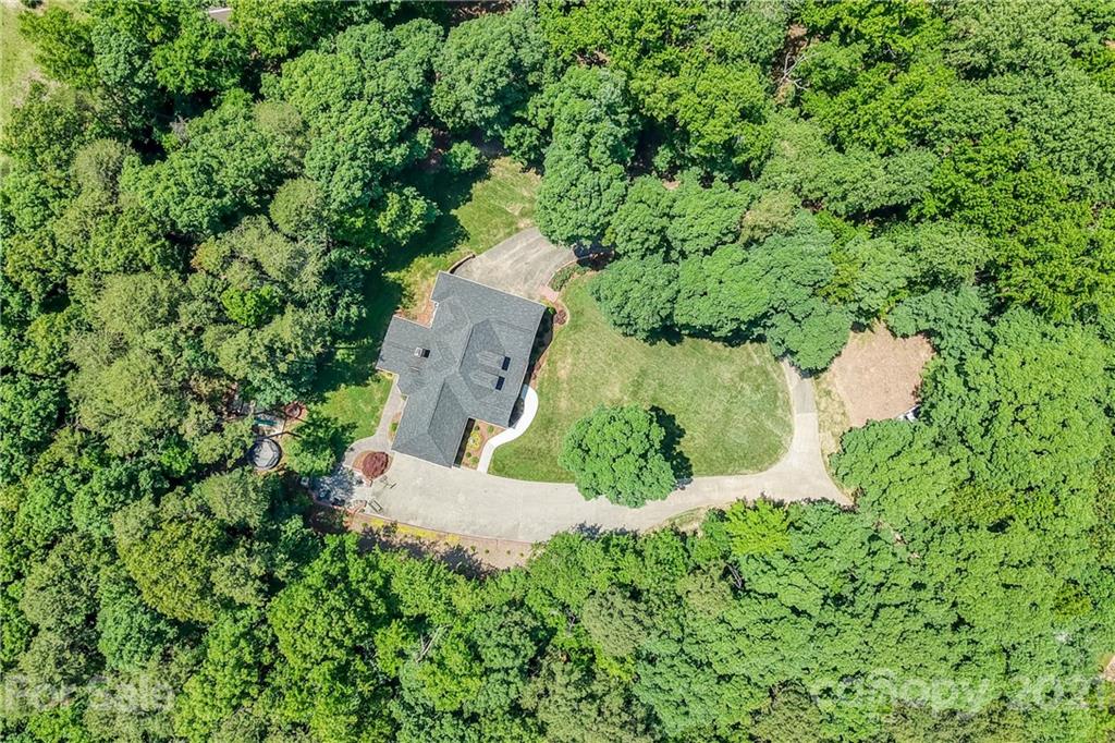 1172 Ben Black Road Midland, NC 28107 - Photo 44 of 48 an aerial view of a house with a yard and trees all around