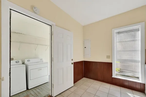 a view of storage and utility room with empty racks
