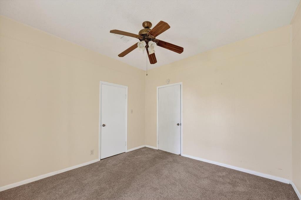 800 South Jefferson Street Pilot Point, TX 76258 - Photo 15 of 27 a view of empty room with wooden floor and ceiling fan