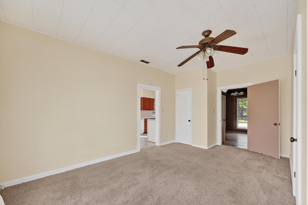 800 South Jefferson Street Pilot Point, TX 76258 - Photo 16 of 27 a view of a big room with chandelier fan and closet