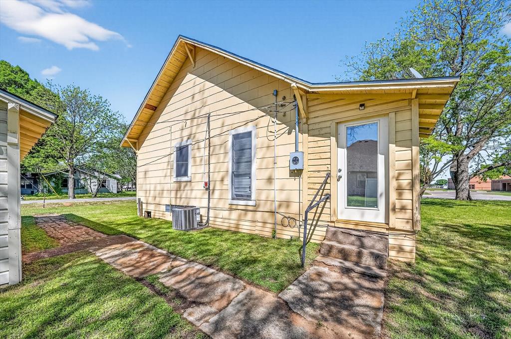 800 South Jefferson Street Pilot Point, TX 76258 - Photo 21 of 27 a view of a house with a yard