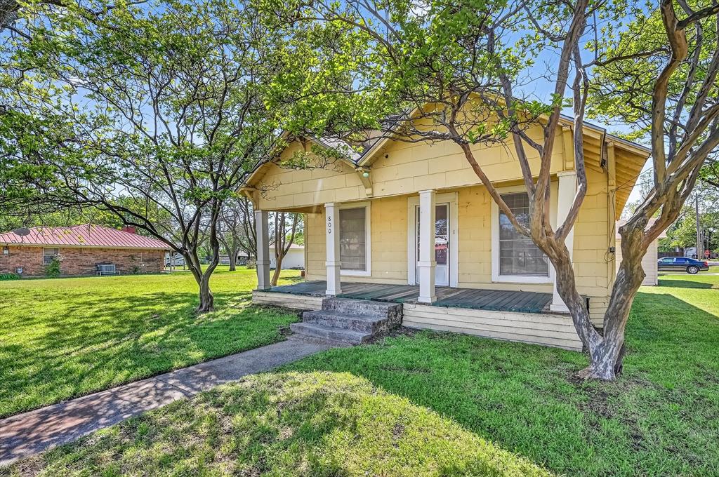 800 South Jefferson Street Pilot Point, TX 76258 - Photo 23 of 27 a view of a house with a yard