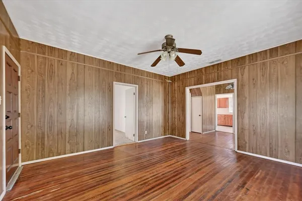 a view of hallway with wooden floor