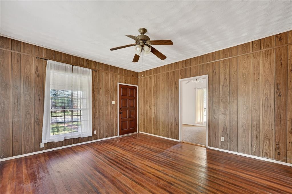 800 South Jefferson Street Pilot Point, TX 76258 - Photo 6 of 27 a view of empty room with wooden floor and fan