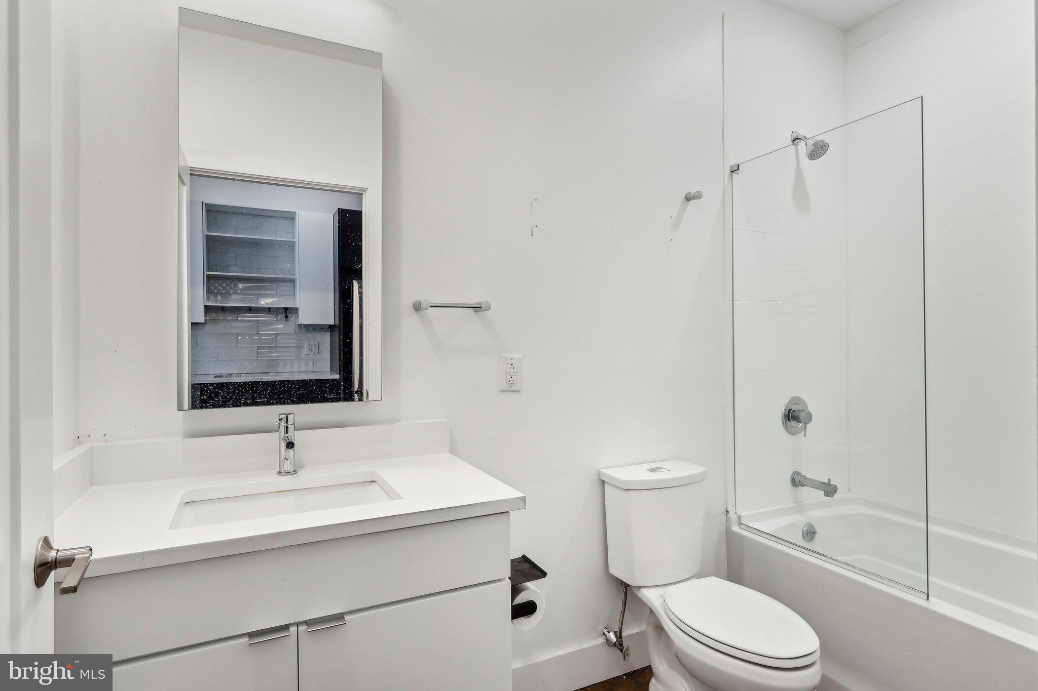 2000 North 2nd Street, Unit 404 Philadelphia, PA 19122 - Photo 2 of 9 a bathroom with a sink toilet and shower