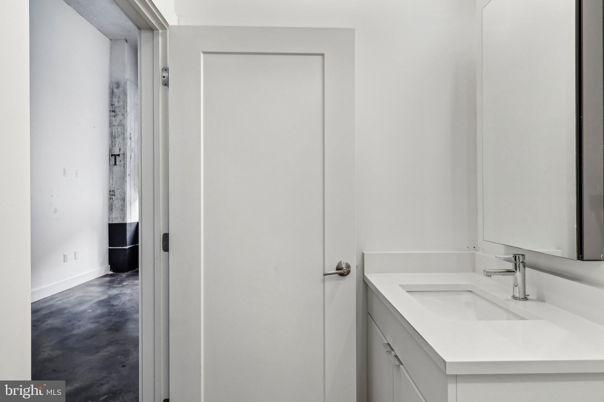 2000 North 2nd Street, Unit 404 Philadelphia, PA 19122 - Photo 3 of 9 a bathroom with a sink and a mirror