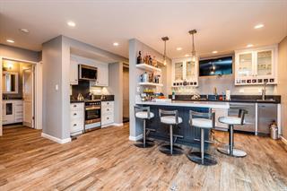 200 5th Avenue, Unit 4 Santa Cruz, CA 95062 - Photo 3 of 12 a kitchen with stainless steel appliances kitchen island granite countertop a table chairs sink and cabinets