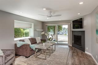 200 5th Avenue, Unit 4 Santa Cruz, CA 95062 - Photo 5 of 12 a living room with furniture and a fireplace