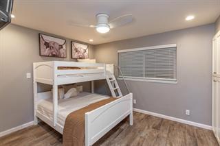 200 5th Avenue, Unit 4 Santa Cruz, CA 95062 - Photo 8 of 12 a bed room with a bed and paintings on the wall