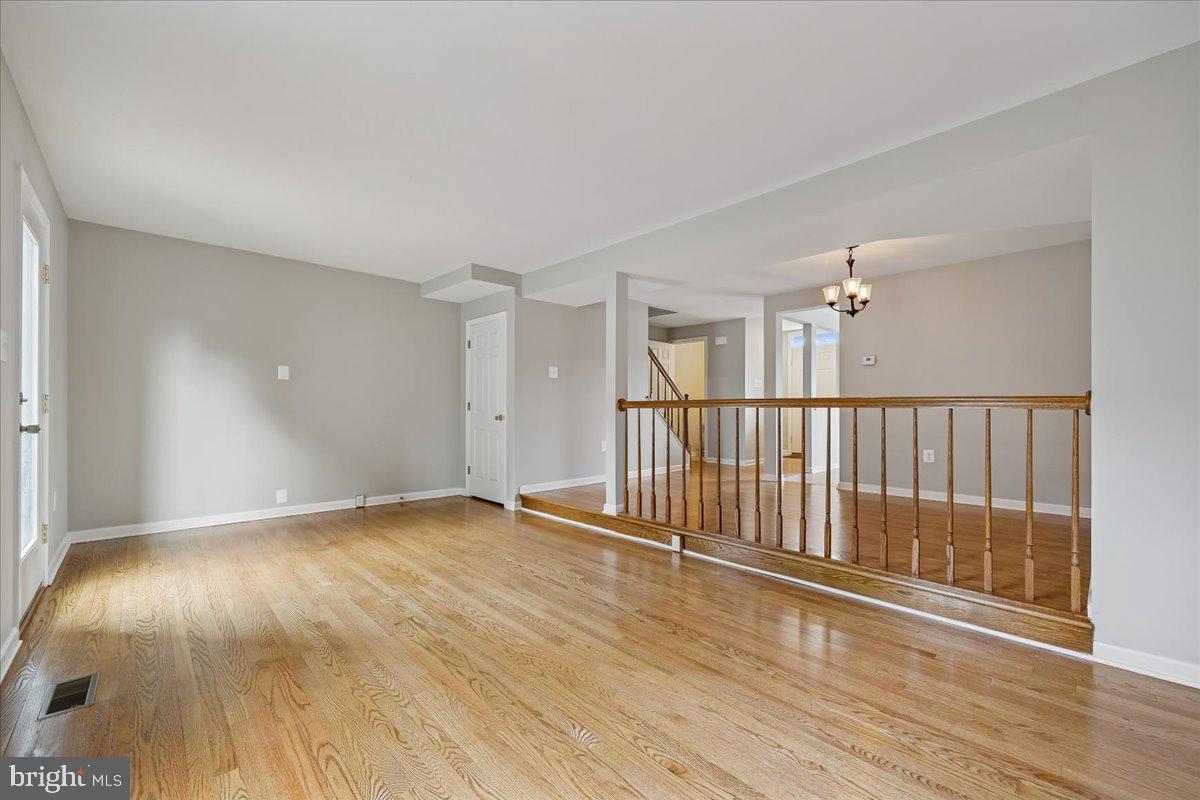 8024 Waterview Court Frederick, MD 21701 - Photo 14 of 72 wooden floor in an empty room