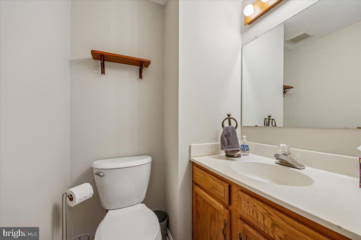 8024 Waterview Court Frederick, MD 21701 - Photo 17 of 72 a bathroom with a toilet sink and mirror