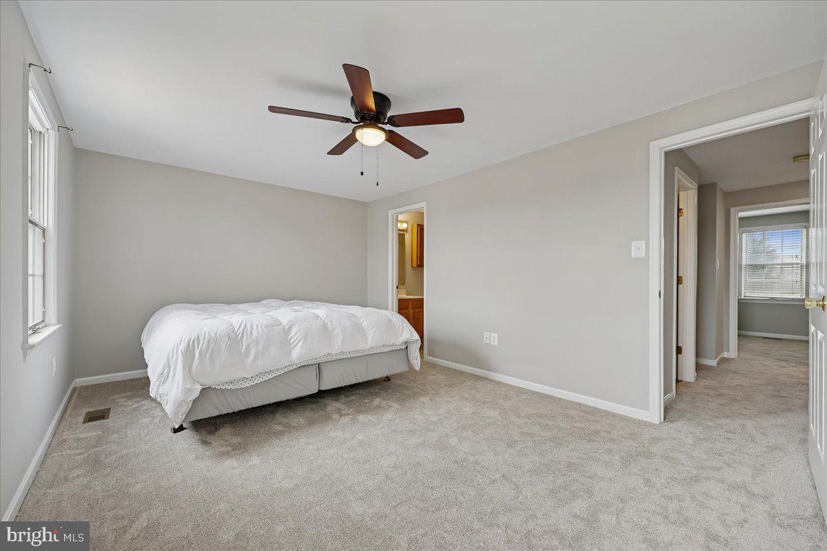 8024 Waterview Court Frederick, MD 21701 - Photo 19 of 72 a bedroom with a bed and ceiling fan