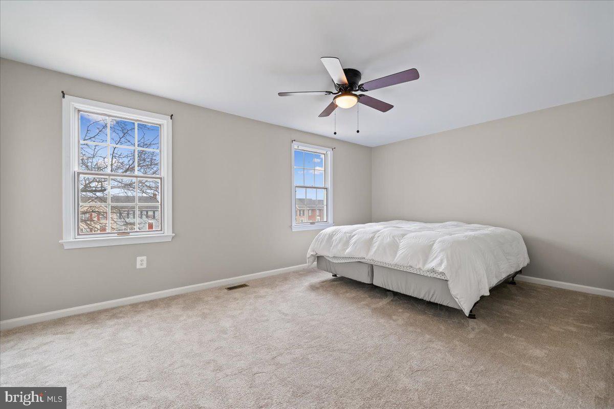 8024 Waterview Court Frederick, MD 21701 - Photo 20 of 72 a bedroom with a bed ceiling fan and window