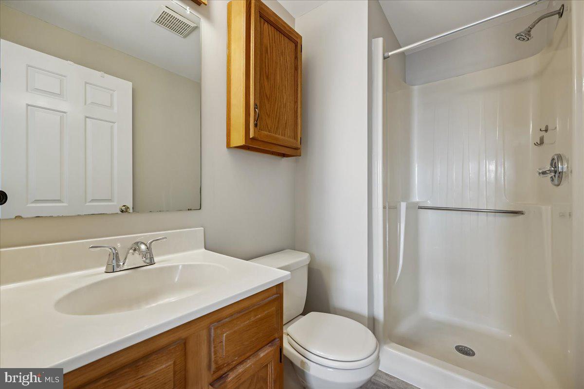 8024 Waterview Court Frederick, MD 21701 - Photo 22 of 72 a bathroom with a granite countertop sink toilet and shower