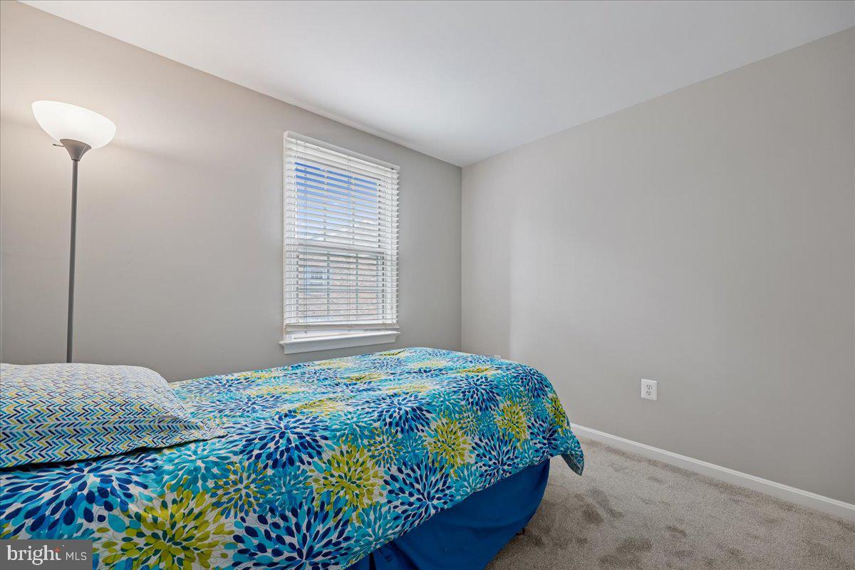8024 Waterview Court Frederick, MD 21701 - Photo 23 of 72 a bedroom with a bed and a window