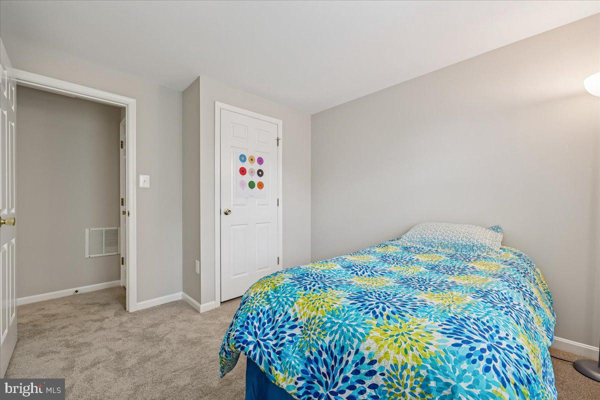 8024 Waterview Court Frederick, MD 21701 - Photo 24 of 72 a bedroom with a bed and a painting on the wall