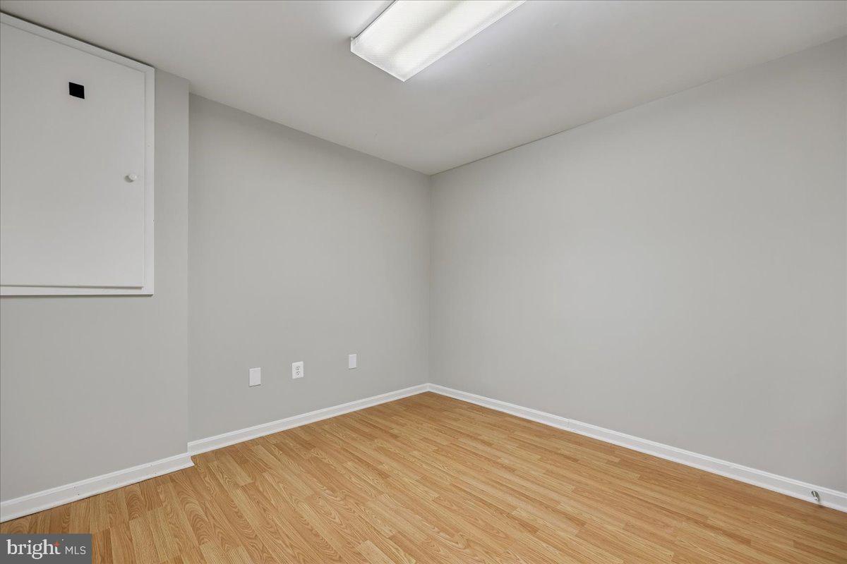 8024 Waterview Court Frederick, MD 21701 - Photo 34 of 72 a view of an empty room with wooden floor