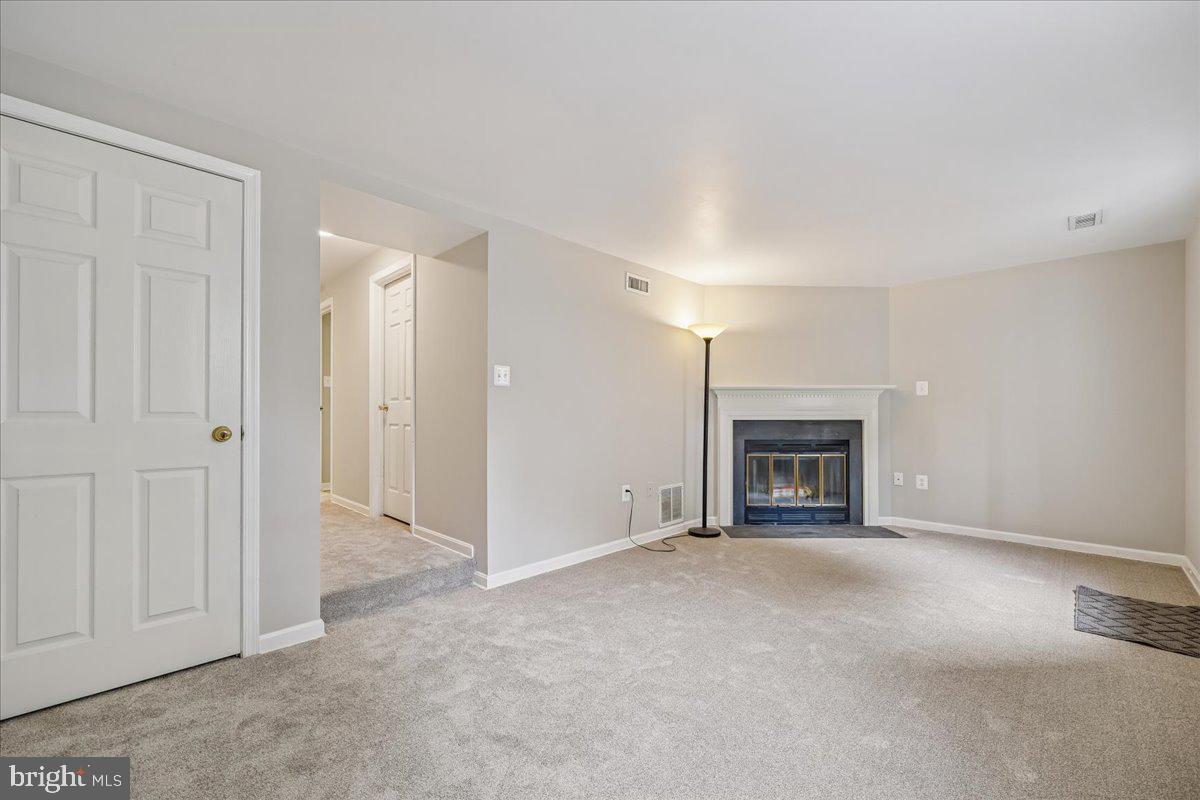 8024 Waterview Court Frederick, MD 21701 - Photo 35 of 72 a view of an empty room with a fireplace