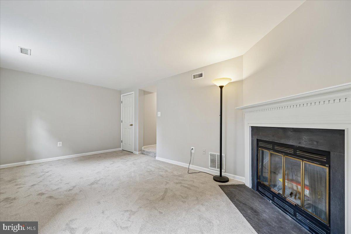 8024 Waterview Court Frederick, MD 21701 - Photo 37 of 72 a view of an empty room with a fireplace