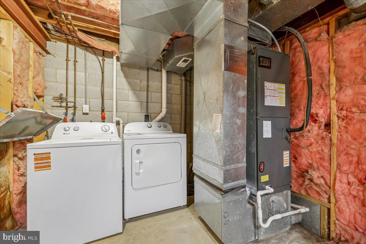 8024 Waterview Court Frederick, MD 21701 - Photo 39 of 72 a utility room with dryer and washer