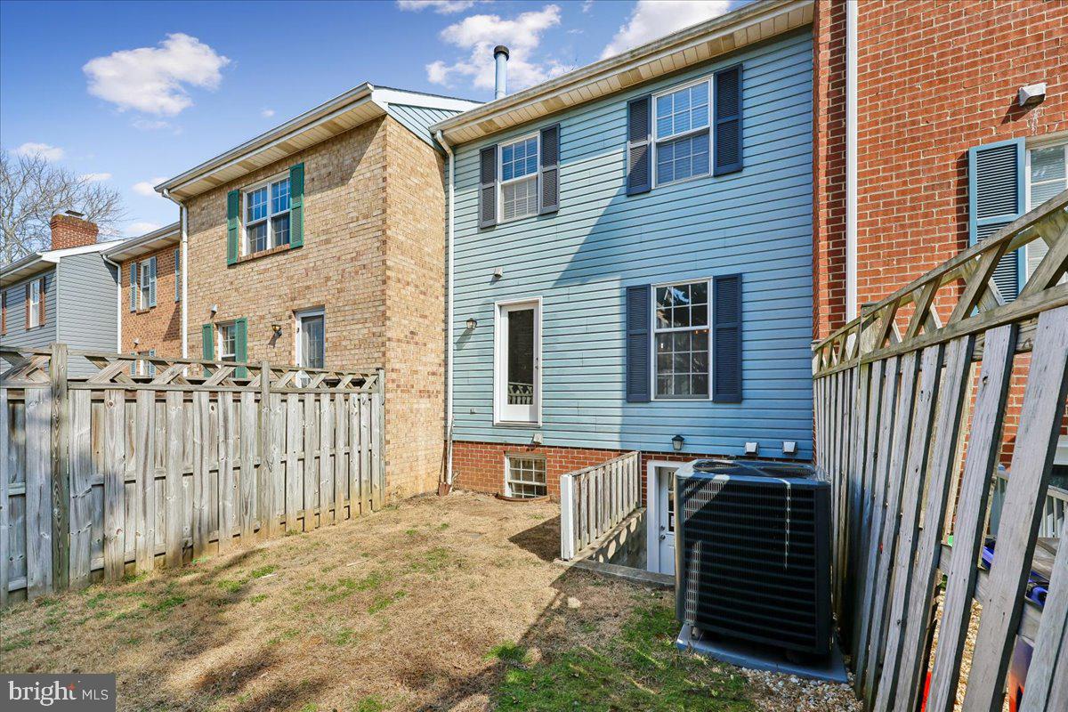 8024 Waterview Court Frederick, MD 21701 - Photo 43 of 72 a front view of a house with wooden fence