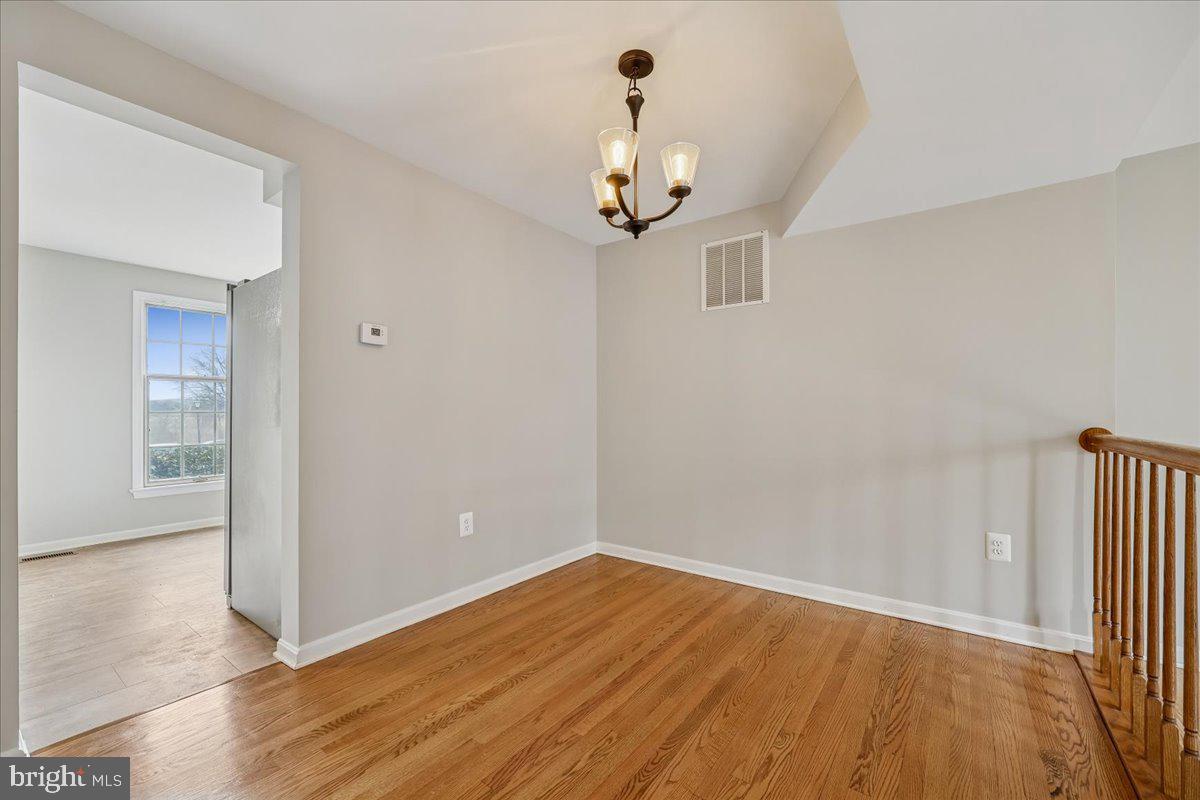 8024 Waterview Court Frederick, MD 21701 - Photo 9 of 72 wooden floor in an empty room with a window