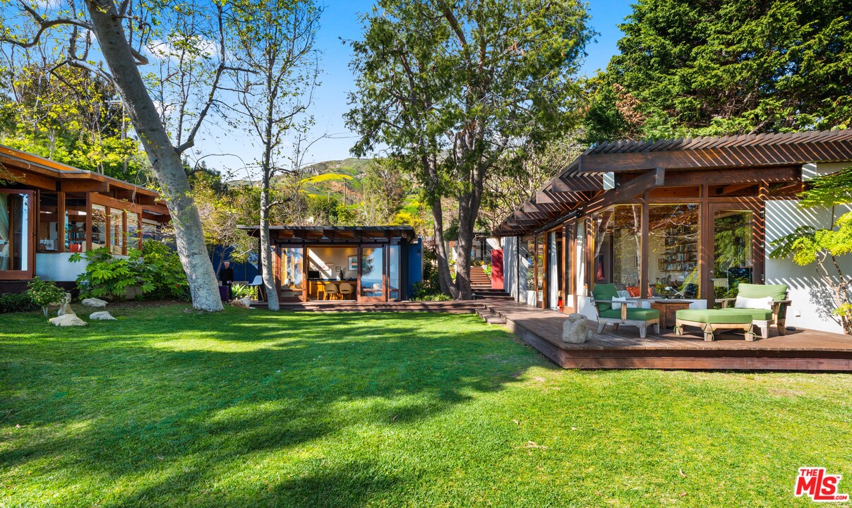 32496 Pacific Coast Highway Malibu, CA 90265 - Photo 13 of 51 a view of a house with backyard and sitting area
