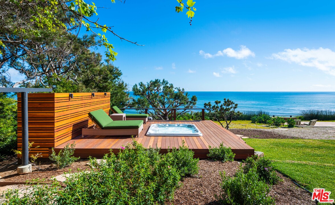 32496 Pacific Coast Highway Malibu, CA 90265 - Photo 27 of 51 a view of a back yard of the house and front view of a house