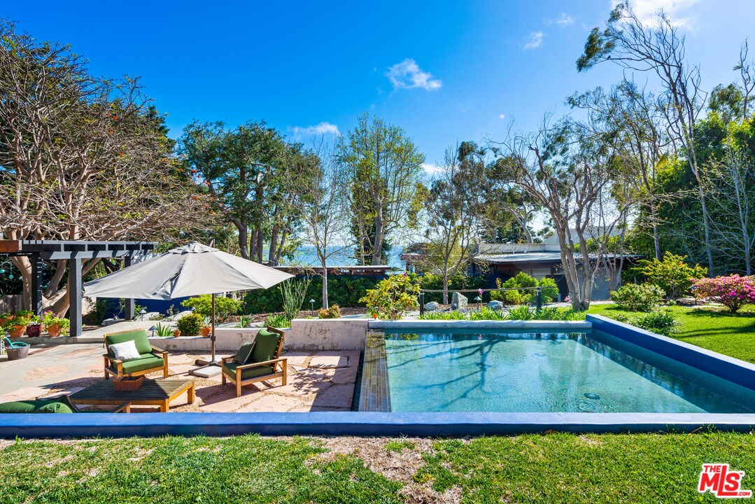 32496 Pacific Coast Highway Malibu, CA 90265 - Photo 37 of 51 a view of swimming pool with outdoor seating and plants