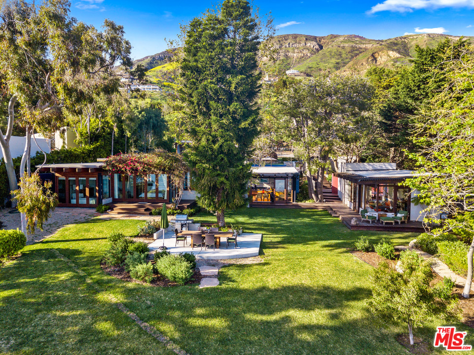 32496 Pacific Coast Highway Malibu, CA 90265 - Photo 4 of 51 a front view of a building with garden