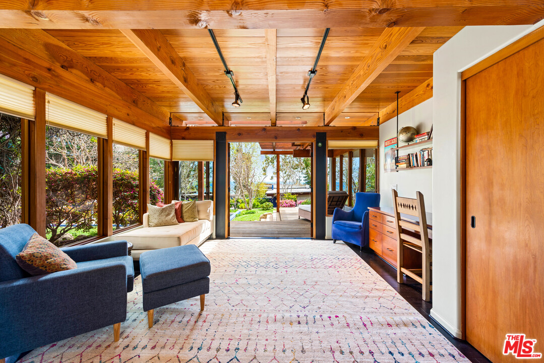 32496 Pacific Coast Highway Malibu, CA 90265 - Photo 42 of 51 a bedroom with furniture and large windows