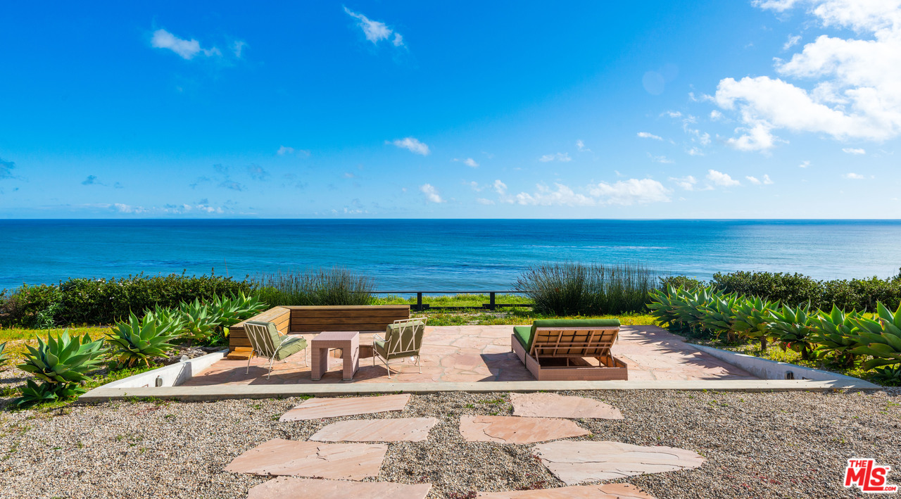 32496 Pacific Coast Highway Malibu, CA 90265 - Photo 5 of 51 a view of a terrace with a garden