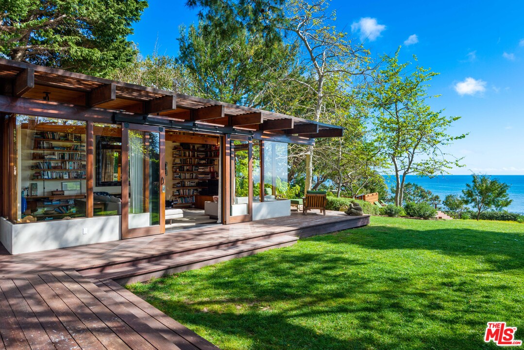 32496 Pacific Coast Highway Malibu, CA 90265 - Photo 10 of 51 a view of a chair and table in backyard of the house