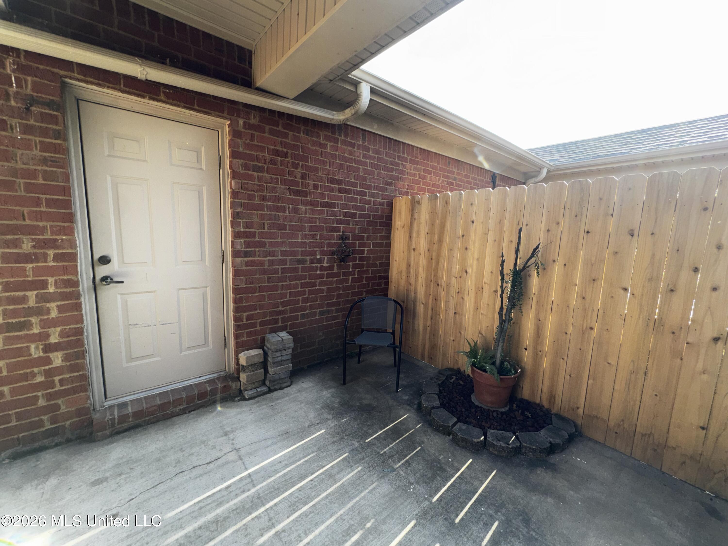 856 Cardinal Lane Hernando, MS 38632 - Photo 12 of 16 Covered walkway from garage to Kitchen