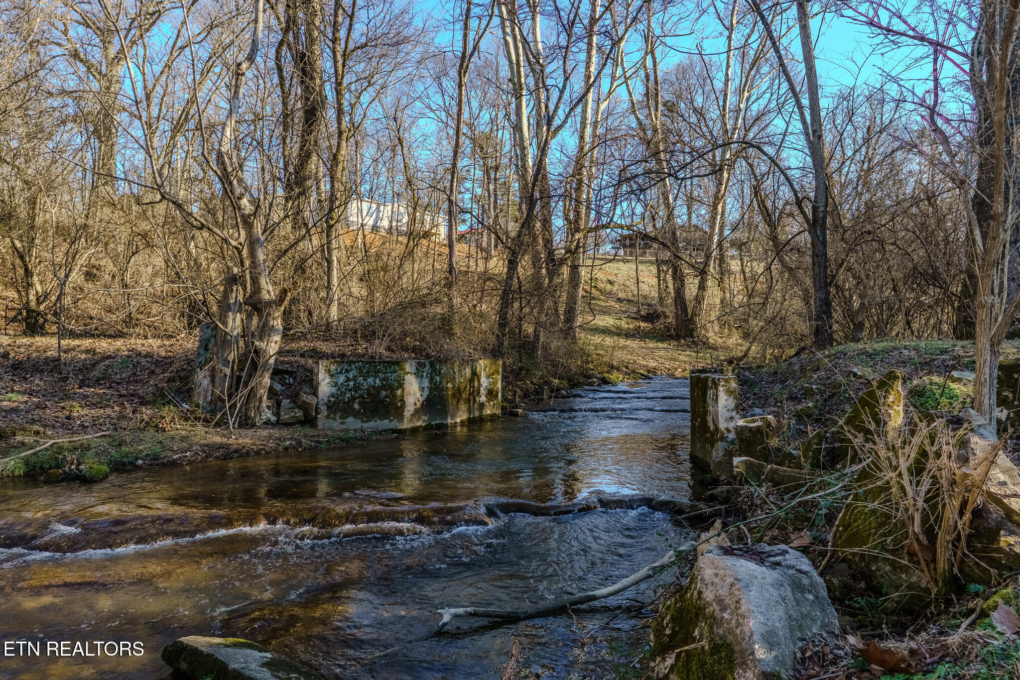 Creek w:existing bridge pillars