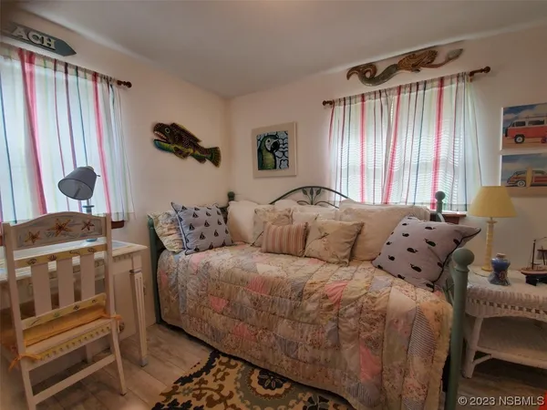 a bed room with a bed and a window