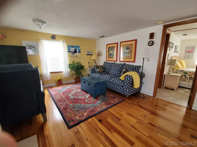 a living room with furniture and a rug