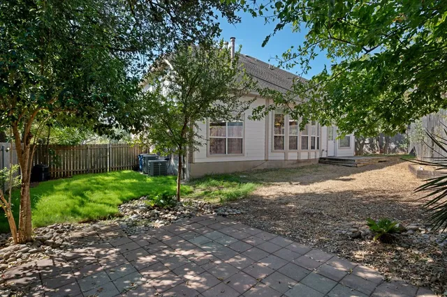 a house view with a backyard space
