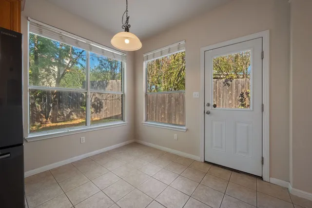 a view of an empty room with windows