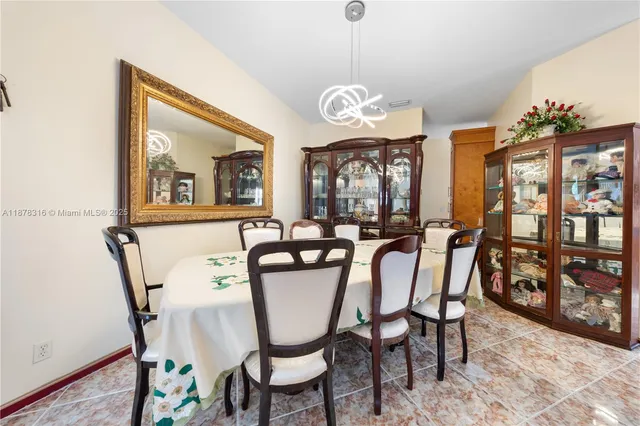 a living room with furniture a rug and a flat screen tv