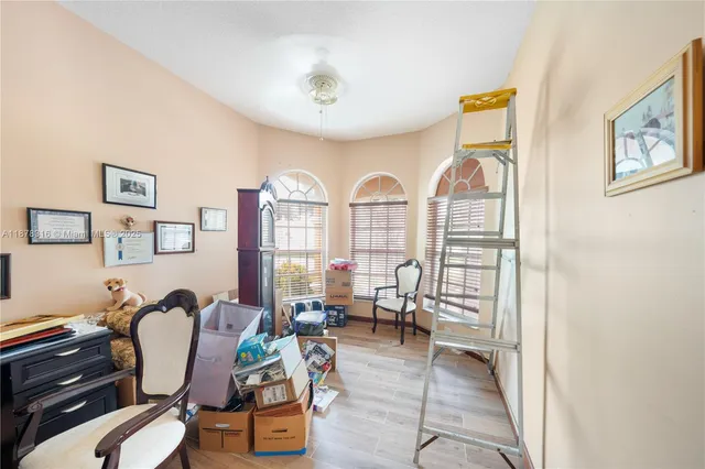a living room filled with furniture and a floor to ceiling window