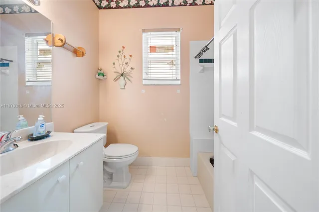 a kitchen with stainless steel appliances granite countertop sink stove and refrigerator